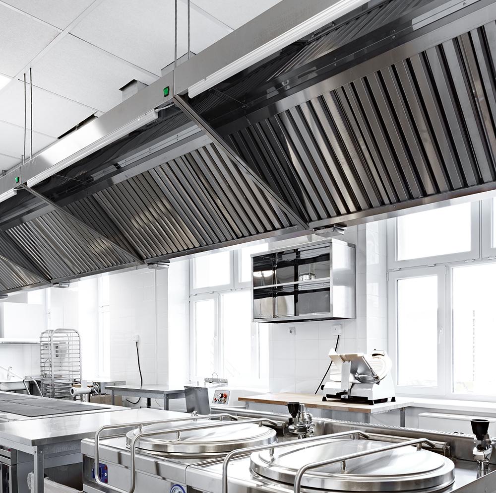 DCD Certified technicians repairing commercial kitchen hood in Dubai